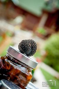 a mason jar with a blackberry on top of it at Kedra Village in Kédra