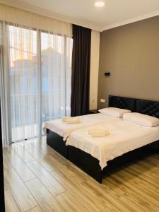 Postel nebo postele na pokoji v ubytování Hotel Niko