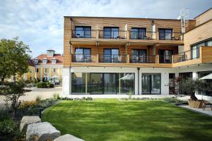 a building with a lawn in front of it at Babenbergerhof in Ybbs an der Donau