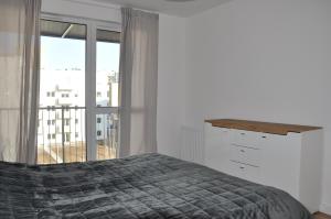 Posteľ alebo postele v izbe v ubytovaní WROCLOVE_NET APARTMENTS