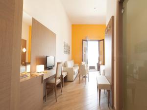 TV a/nebo společenská místnost v ubytování La Casarana Wellness Ecoresort
