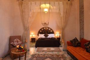 a bedroom with a bed and a couch at Riad Manissa in Marrakesh +98 photos