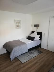 Ένα ή περισσότερα κρεβάτια σε δωμάτιο στο Ferienwohnung Hirmer