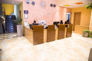 an office with a lobby with a reception desk at Vamos Addis Hotel in Addis Ababa