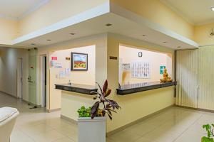 a hospital lobby with a waiting room with aocratesknifeknife at Hotel Cuesta de Miranda in Villa Unión +143 photos