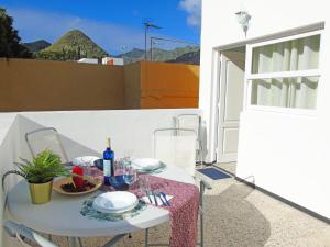 a table with a plate of food on a balcony at Fleitas Penthouse with terrace in San Andrés