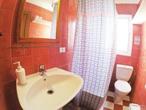 a bathroom with a sink and a toilet at Fleitas Penthouse with terrace in San Andrés
