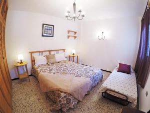a bedroom with a bed and a bench in it at Fleitas Penthouse with terrace in San Andrés