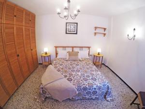 a bedroom with a large bed with two night stands at Fleitas Penthouse with terrace in San Andrés