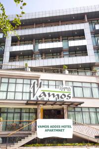 a building with a sign that reads yams aids hotelartney at Vamos Addis Hotel in Addis Ababa