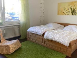 Postel nebo postele na pokoji v ubytování Ferienwohnung In den Haargärten