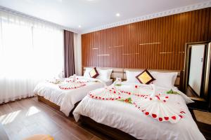 Postel nebo postele na pokoji v ubytování Anasia Hotel