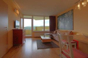 a living room with a couch and a table at Apartment 551 in Hohegeiß