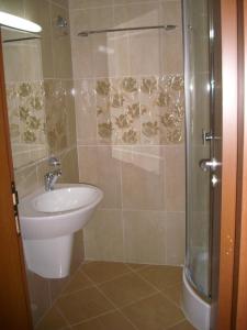 a bathroom with a shower and a toilet and a sink at Apartments in Relax Complex Fantasy in Hisarya +11 photos