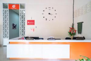 an office with a clock on the wall at RedDoorz @ Jalan Pendidikan Mataram in Tanjungkarang