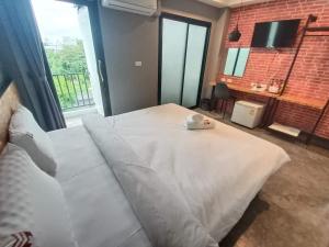 Postel nebo postele na pokoji v ubytování Modern Budget Hotel