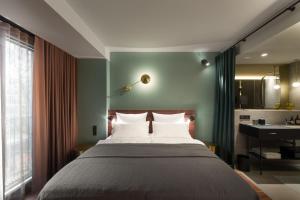 Letto o letti in una camera di EmiLu Design Hotel