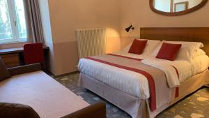 a bedroom with a large bed and a mirror at Dimora del Leone Gaeta in Gaeta