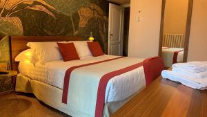 a bedroom with a large bed in a room at Dimora del Leone Gaeta in Gaeta