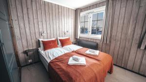 En eller flere senge i et værelse på Danebu Kongsgaard - Boutique Hotel