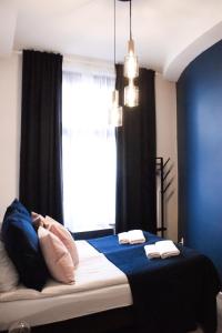 Posteľ alebo postele v izbe v ubytovaní EURO-ROOM