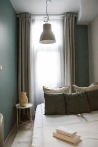 Posteľ alebo postele v izbe v ubytovaní EURO-ROOM
