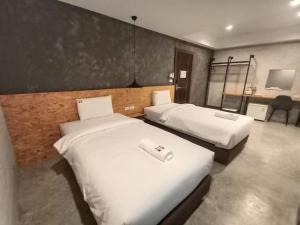 Postel nebo postele na pokoji v ubytování Modern Budget Hotel