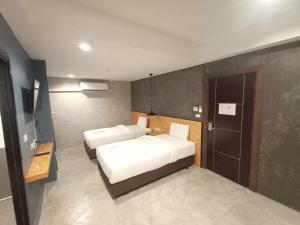 Postel nebo postele na pokoji v ubytování Modern Budget Hotel