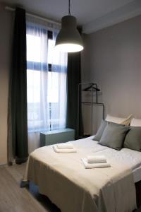 Posteľ alebo postele v izbe v ubytovaní EURO-ROOM