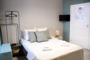 Posteľ alebo postele v izbe v ubytovaní EURO-ROOM