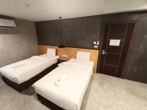 Postel nebo postele na pokoji v ubytování Modern Budget Hotel