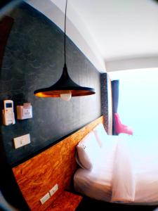Postel nebo postele na pokoji v ubytování Modern Budget Hotel