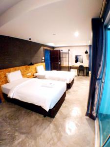 Postel nebo postele na pokoji v ubytování Modern Budget Hotel