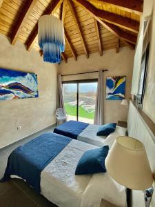 Postel nebo postele na pokoji v ubytování Seaside Villa in El Roque (El Cotillo) with Private Pool
