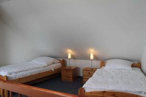Postel nebo postele na pokoji v ubytování KW42-306 Haus Triton