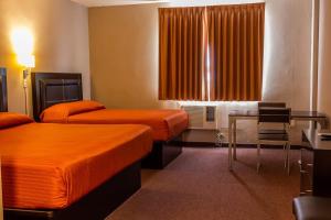 A bed or beds in a room at BONITTO INN® Tampico Lomas