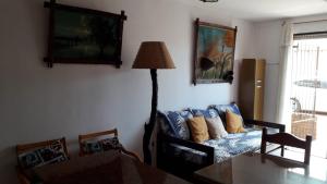 a living room with a couch and a table at Apartamento La balconada in La Paloma