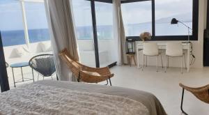 Postel nebo postele na pokoji v ubytování Home2Book Luxury Panoramic Sea Views Tabaiba
