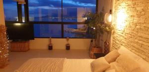Postel nebo postele na pokoji v ubytování Home2Book Luxury Panoramic Sea Views Tabaiba