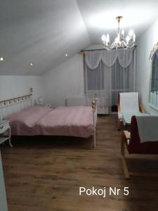 Postel nebo postele na pokoji v ubytování Villa Orzechowski + 13 fotografií