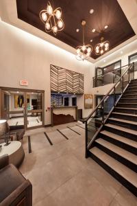 a large room with a stairway leading to a stairwell at Stay Inn Hotel Toronto in Toronto