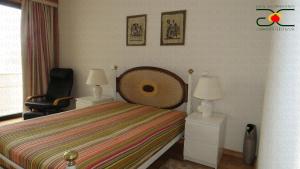 Ένα ή περισσότερα κρεβάτια σε δωμάτιο στο Caminhada Guest Room