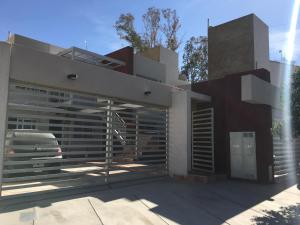 a modern house with a large glass facade at Como en casa... en gran Mendoza in Mendoza
