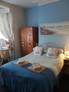 Ένα ή περισσότερα κρεβάτια σε δωμάτιο στο Schofield Guest House