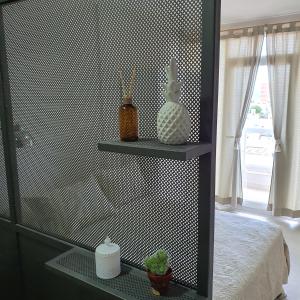 a bedroom with a black and white patterned wall at Bonito Departamento a metros del MAR . in Puerto Madryn