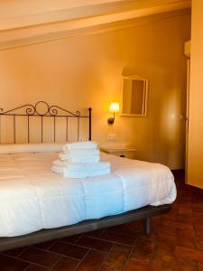 En eller flere senge i et værelse på Hotel Plaza Grande