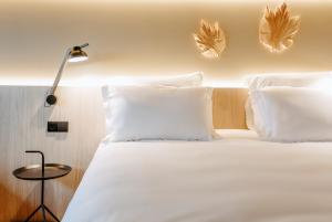 Postel nebo postele na pokoji v ubytování Mercure Fátima