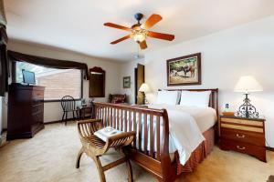 a bedroom with a bed and a ceiling fan at Granite A in Jackson