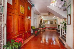 a hallway with a christmas tree in a building at Suites Plaza del Rio - Family Hotel Malecón Centro in Puerto Vallarta