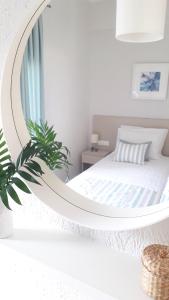 Postel nebo postele na pokoji v ubytování Kelly's Beach Apts